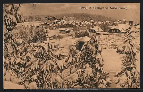 AK Oberhof /Thüringen, Ortsansicht mit Tannen im Winter