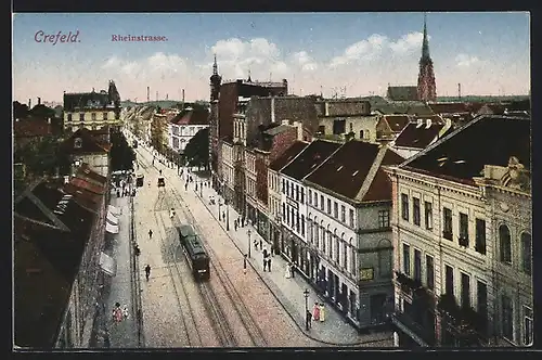 AK Crefeld, Blick auf die Rheinstrasse mit Strassenbahn und Kirche