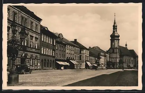 AK Falkenau /Eger, Ortspartie mit Geschäften und Kirche