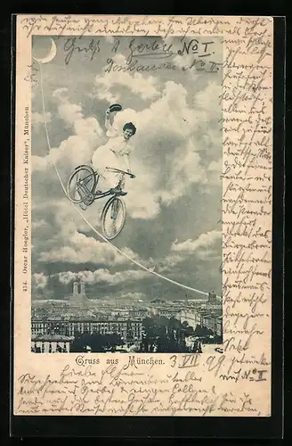 AK München, Radlerin saust am vom Mond gespannten Seil hinunter in die Stadt