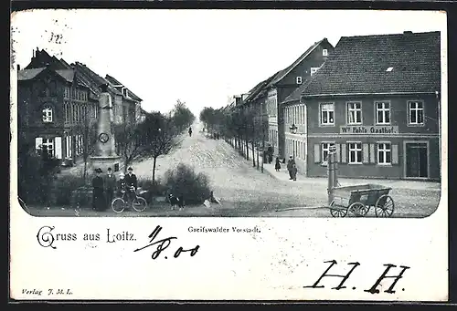 AK Loitz, Greifswalder Vorstadt, Strassenpartie mit Fahls Gasthof und Denkmal