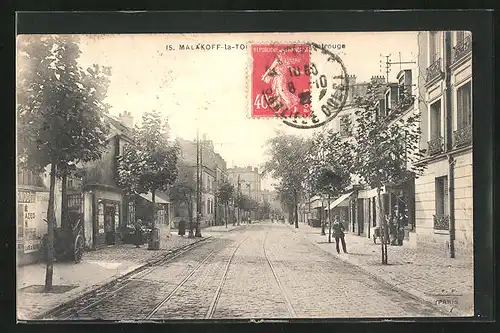 AK Malakoff, Blick in eine Strasse mit Gleisen