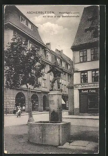AK Aschersleben, Holzträgerbrunnen am Strasseneck Holzmarkt
