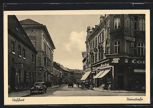 AK Stassfurt, Steinstrasse mit Gasthaus Stadtschänke und Geschäften