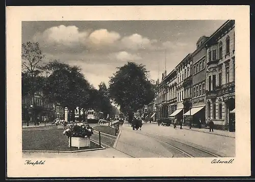 AK Krefeld, Strasse am Osterwall mit Geschäften und Strassenbahn