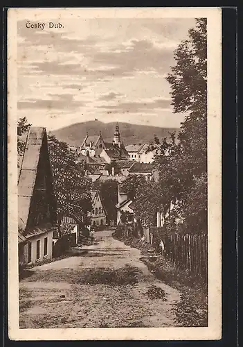 AK Ceský Dub, Strassenpartie mit Kirche