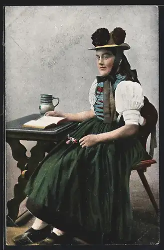 AK Junge Frau in Schwarzwälder Tracht am Tisch