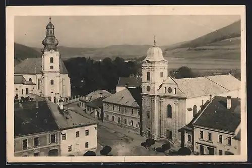 AK Roznava, Ortspartie mit Kirchen aus der Vogelschau
