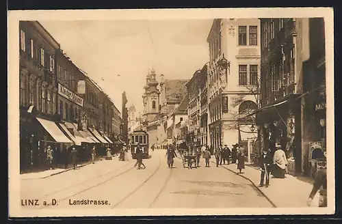 AK Linz a. D., Landstrasse mit Strassenbahn