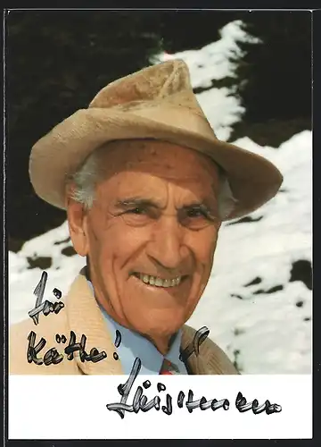 AK Schauspieler Luis Trenker lächelt mit Hut, mit original Autograph