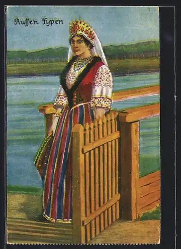 AK Russische Typen, Frau im Trachtenkleid am Ufer