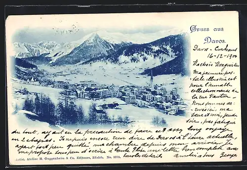 AK Davos, Ortsansicht im Schnee gegen Gebirgsmassiv