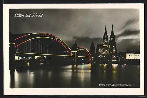 AK Köln, Dom und Hohenzollernbrücke bei Nacht