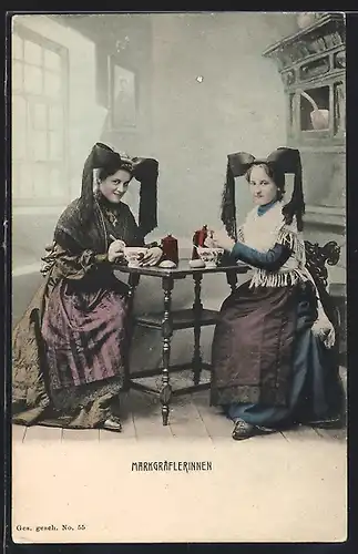AK Zwei junge Markgräflerinnen in Tracht am Tisch sitzend