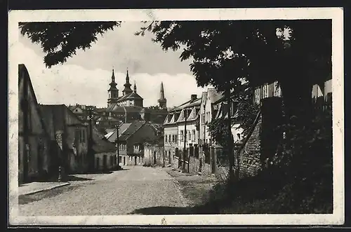 AK Kadan, Strassenpartie mit Kirche