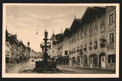 AK Bad Tölz /Obbay., Marktstrasse mit Geschäften und Brunnen