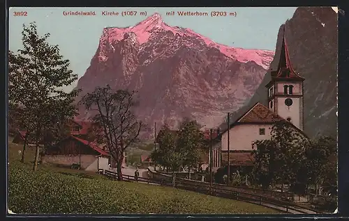 AK Grindelwald, Kirche mit glühendem Wetterhorn und Strasse