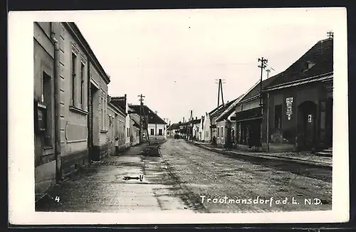 AK Trautmannsdorf an der Leitha Strassenpartie nach dem Regen