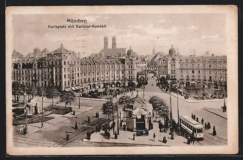 AK München, Strassenbahn in Fahrt, Karlsplatz mit Karlstor-Rondell