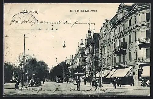 AK Düsseldorf, Königsallee mit Geschäft und Strassenbahn