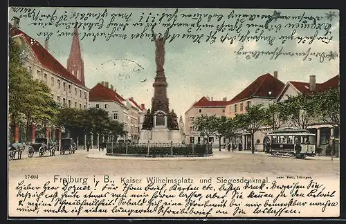 AK Freiburg, Strassenbahn auf dem Kaiser Wilhelmsplatz, Siegesdenkmal