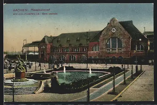 AK Aachen, Hauptbahnhof mit Denkmal und Brunnenanlage