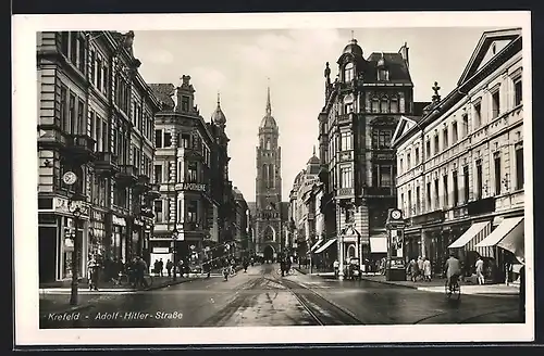 AK Krefeld, Strasse mit Apotheke und Geschäften