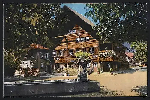 AK Langnau i. E., Strassenpartie mit Brunnen vor dem Bernerhaus