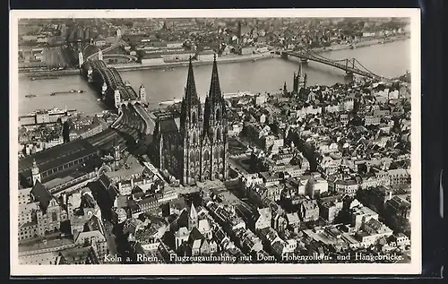 AK Köln, Fliegeraufnahme des Ortes mit Dom, Hohenzollern- u. Hindenburgbrücke