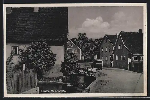 AK Lauter /Mainfranken, Dorfstrassenpartie mit Auto