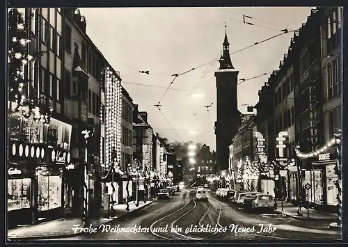 AK Würzburg, Strassenpartie mit Kirche und festlicher Dekoration, Weihnachts- und Neujahrskarte