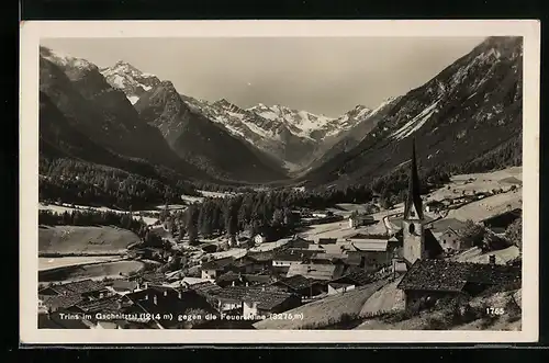 AK Trins im Gschnitztal, Ortsansicht mit Kirche und Bergen