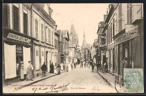AK Laigle, Rue de Bécane, Strassenpartie mit Geschäften
