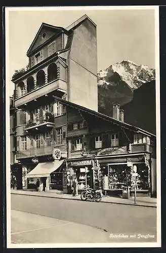 AK Interlaken, Geschäft Brennecke mit Blick zur Jungfrau