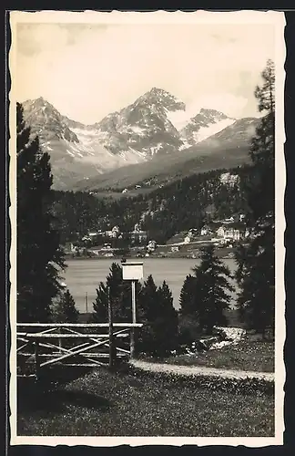 AK St. Moritz, Teilansicht mit See und Holzbrücke