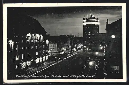 AK Düsseldorf, Strasse am Hindenburgwall mit Wilhelm Marxhaus bei Nacht