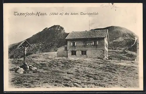 AK Tuxerjochhaus, Berghütte mit Kruzifix