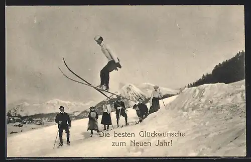 AK Zuschauer beobachten einen Mann beim Ski-Sprung