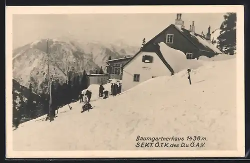 AK Baumgartnerhaus im Schnee mit Wanderern