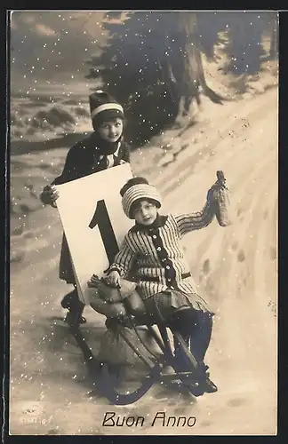 AK Kinder auf einem Schlitten am Neujahrstag