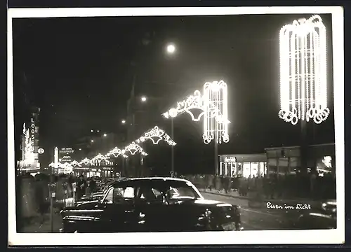 AK Essen, Strassenpartie mit Kirche in nächtlicher Beleuchtung