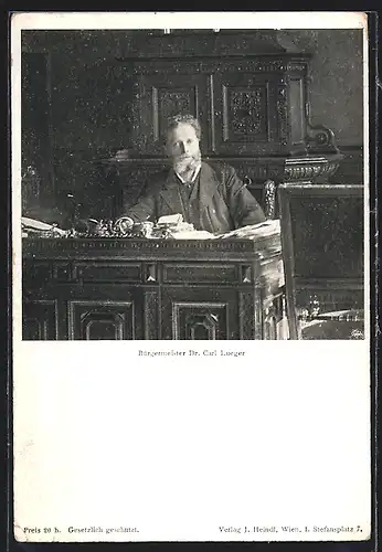 AK Bürgermeister Carl Lueger im schwarzen Anzug hinter seinem Schreibtisch