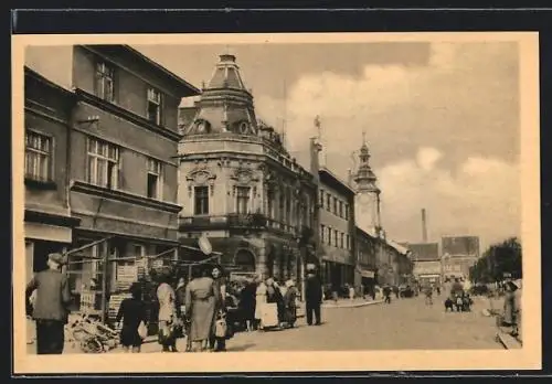 AK Rakovník, Strassenansicht mit Passanten