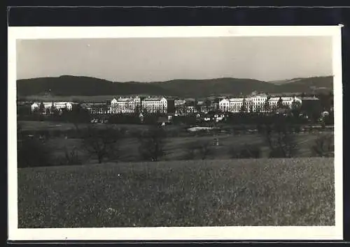 AK Mährisch Weisskirchen, Blick über Felder auf Gebäude