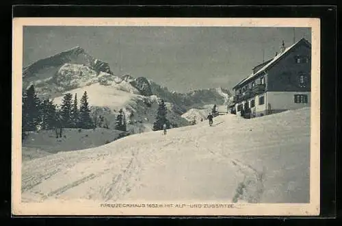 AK Kreuzeckhaus, Berghütte mit Alp- und Zugspitze im Winter