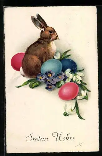 AK Osterhase sitzt zwischen Ostereiern