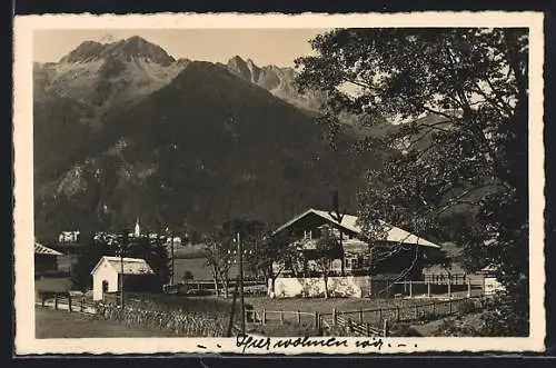 AK Krimml, Försterei Krimml mit Blick auf Ort und Bergwand