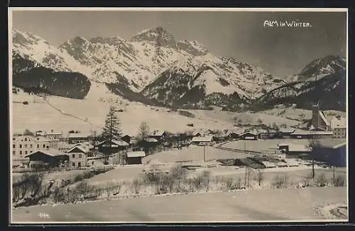 AK Alm, Ortspartie mit Kirche im Winter