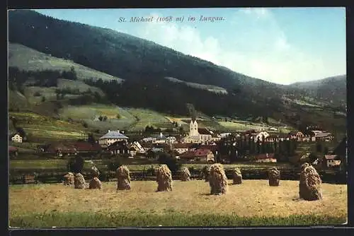 AK St. Michael i. Lungau, Feldpartie mit Heuschobern und Blick zum Ort