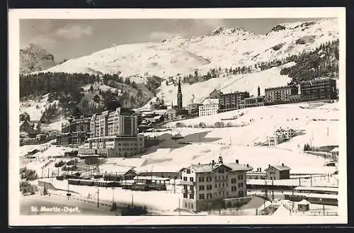 AK St. Moritz-Dorf, verschneite Ortsansicht mit Bahnhof
